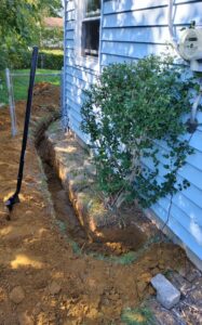 Deshaies Electrical Services digging a trench for electrical lines installation